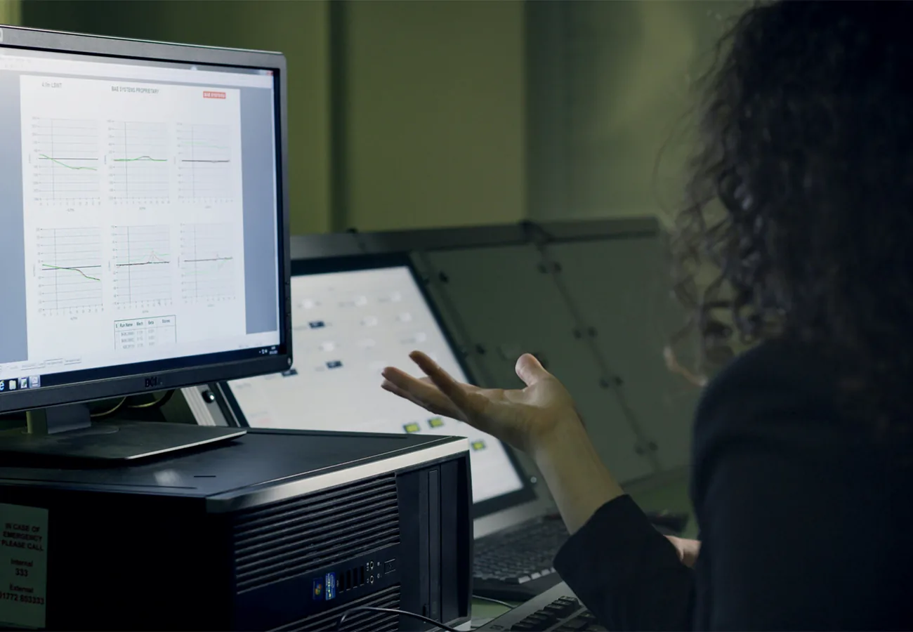 Professional reviewing analytics dashboards on a monitor